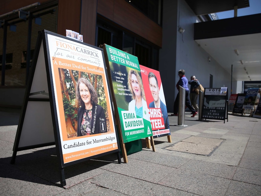 Candidates' signs outside a polling place.