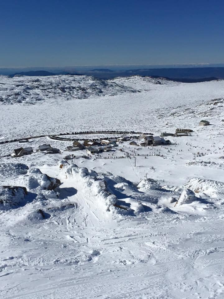 View of a ski resort from mountain peak.