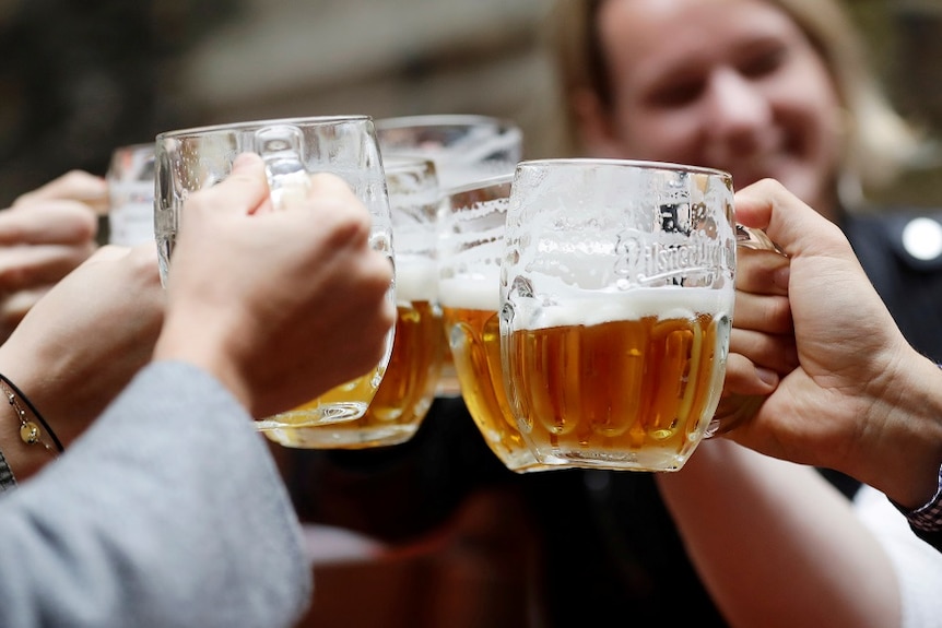 People cheers with beer.