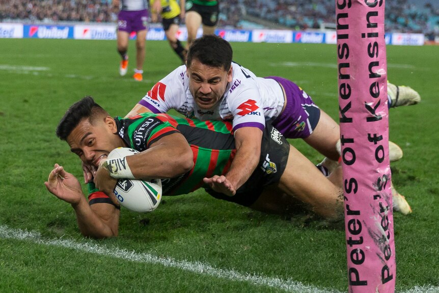 Hymel Hunt dives to score a try for the Rabbitohs in the corner against the Storm.