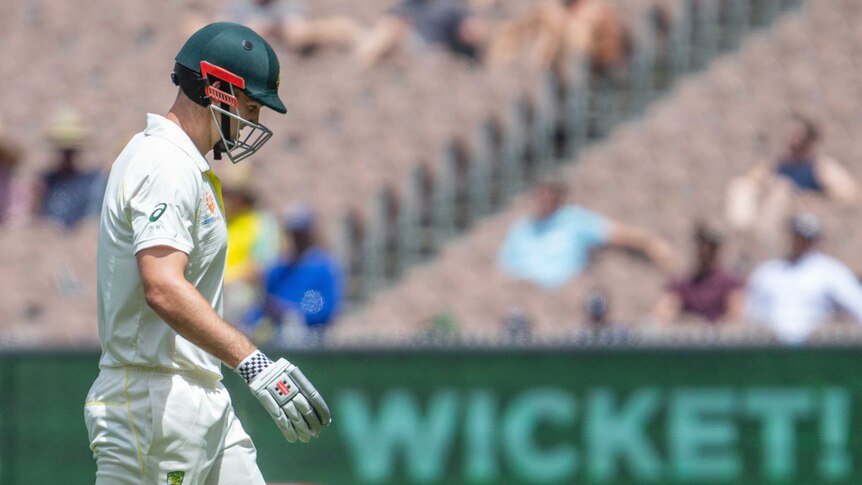 Mitch Marsh walks off dejectedly after his dismissal at the MCG