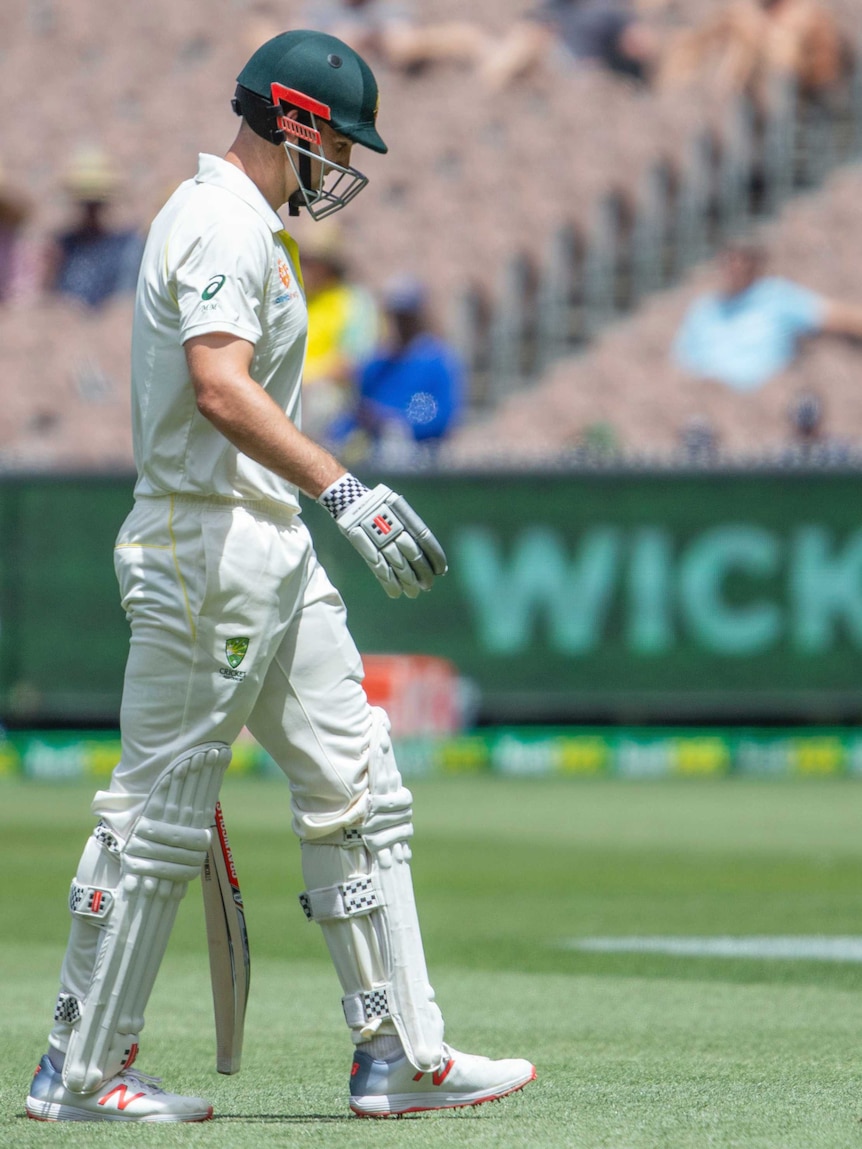 Mitch Marsh walks off dejectedly after his dismissal at the MCG
