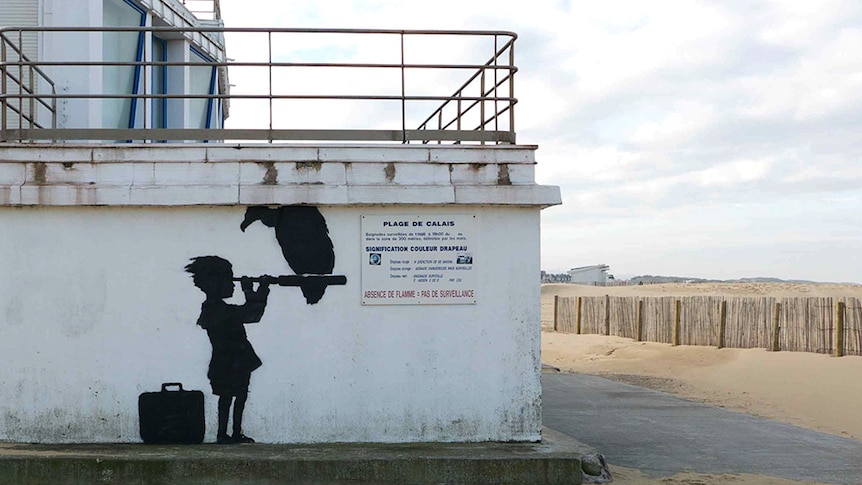 Banksy's mural of a child with a Telescope in Calais