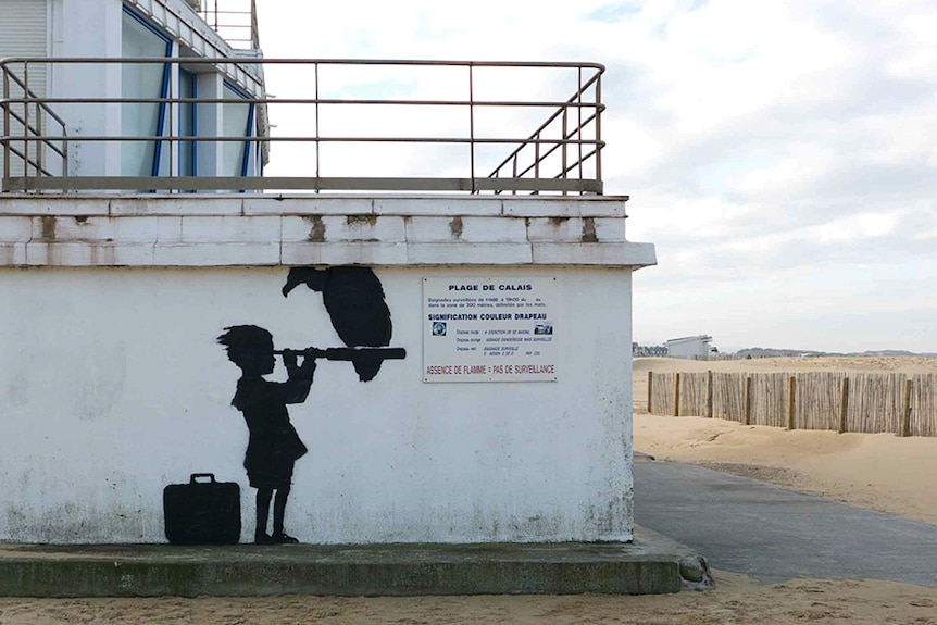 Banksy's mural of a child with a Telescope in Calais