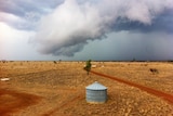 A storm rolls in over a property in western Queensland.