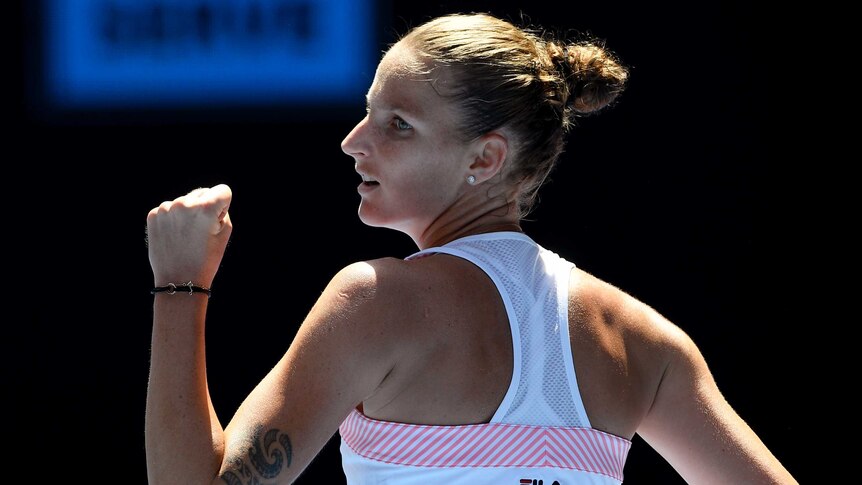 Karolina Pliskova pumps her first during her win over Serena Williams.