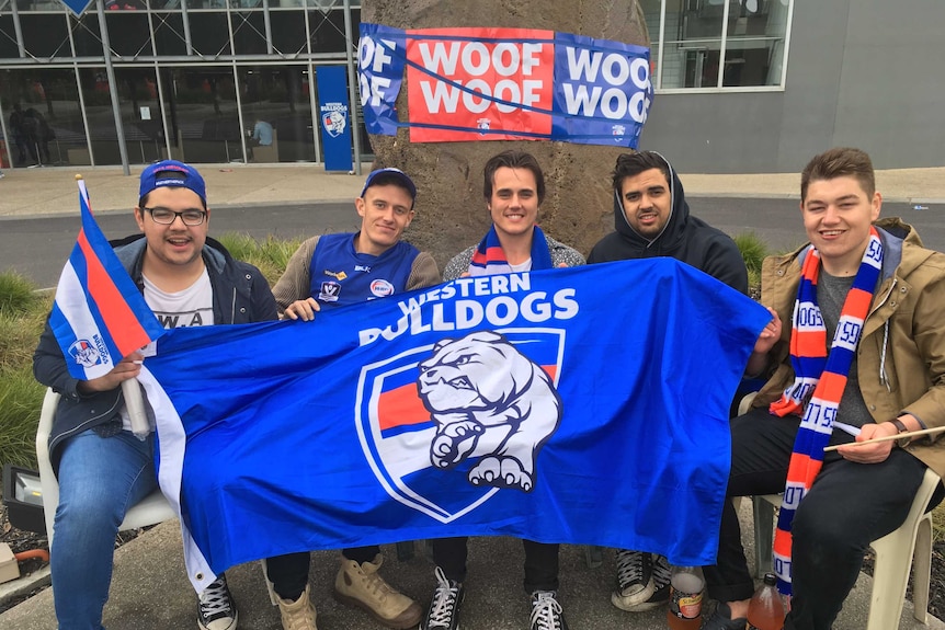 Paying tribute ... Western Bulldogs supporters waiting outside Whitten Oval to meet the players