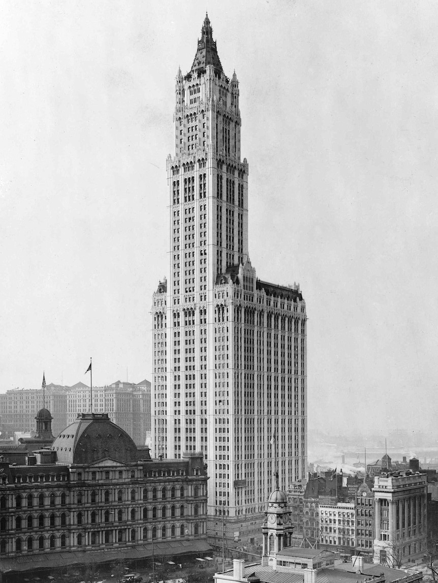 A black and white image of a very tall skyscraper in the early 1900s