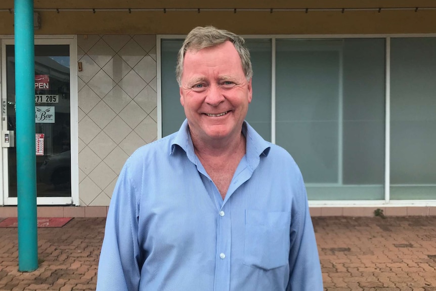 Brian O'Gallagher stands outside a business.