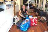 A woman with bags of items