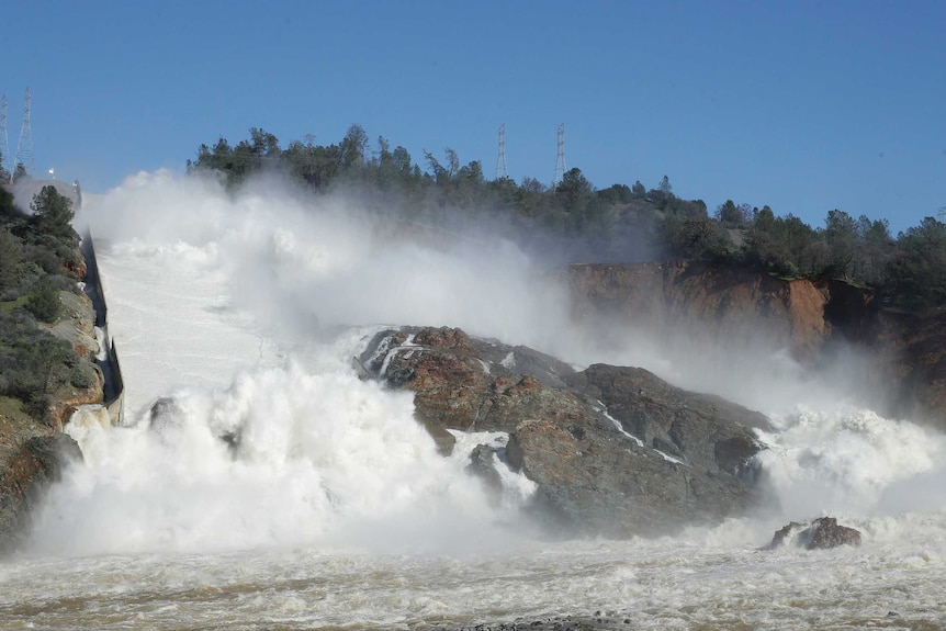 Water flows down Oroville Dam's main spillway on February 11, 2017.