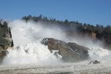 Water flows down Oroville Dam's main spillway on February 11, 2017.