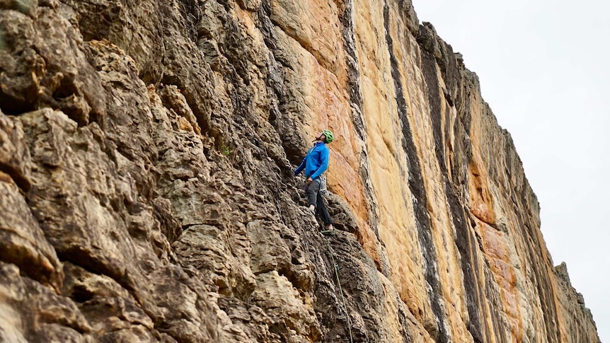 Mark Gould climbing a rock wall at Summer Day Valley in the Grampians