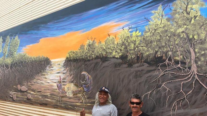 Bardi Artist Herbie Marshall paints mural with his friend Gary Sariago