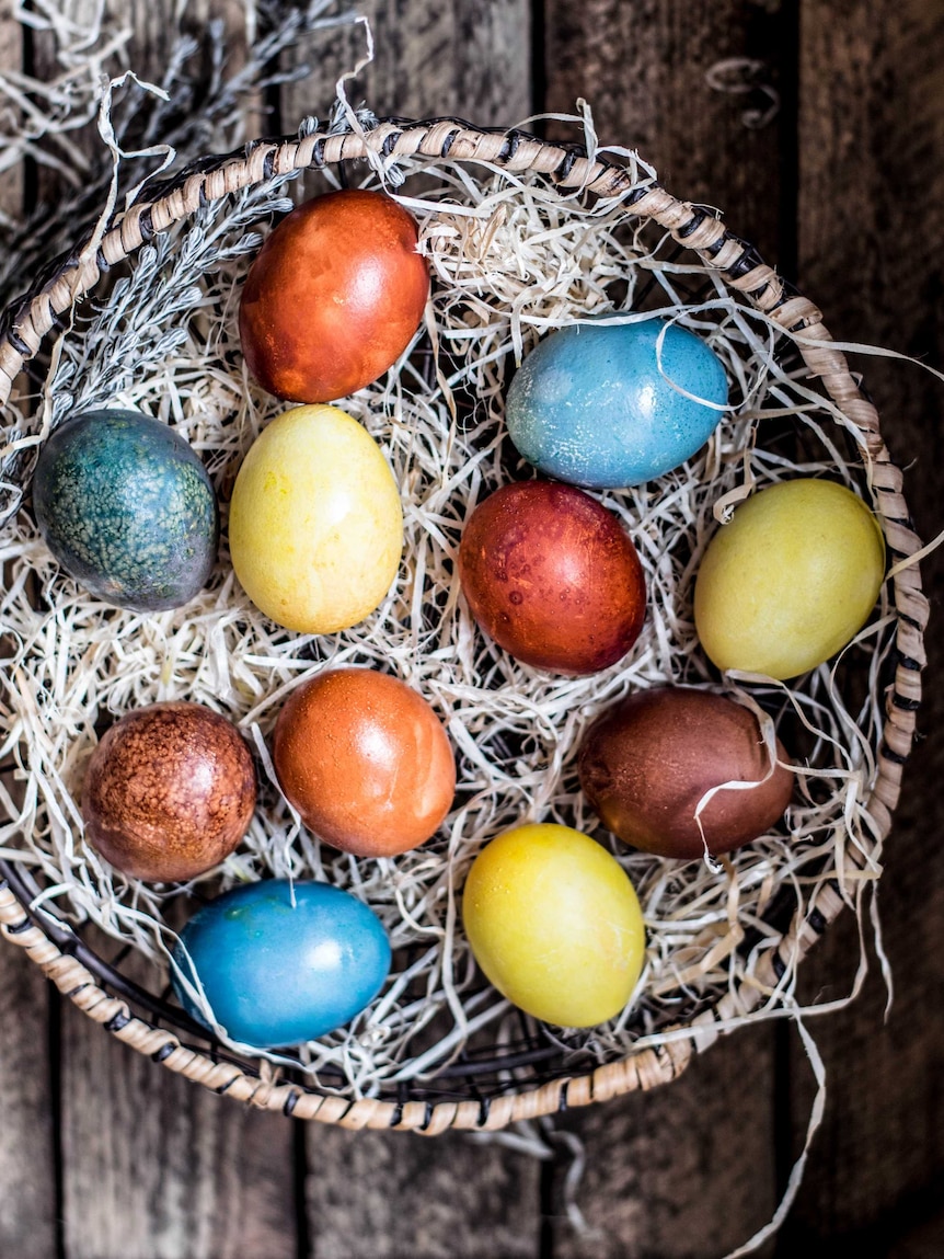 Dyed eggs in a basket.