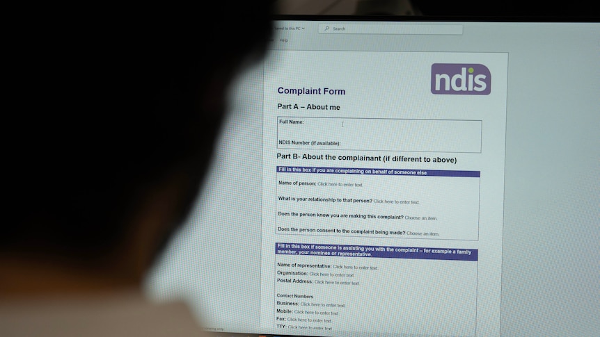 Woman looks at the NDIS complaints form online 