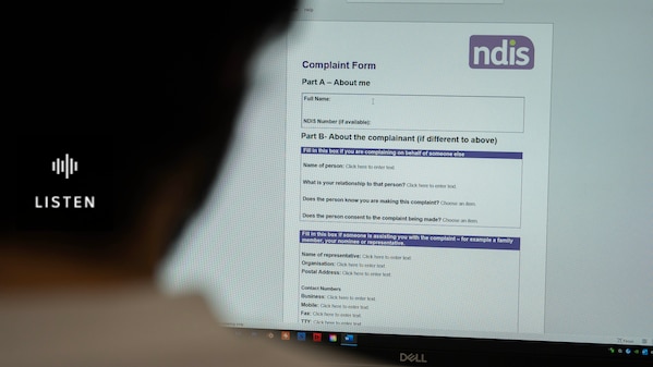 Woman looks at the NDIS complaints form online . Has Audio.