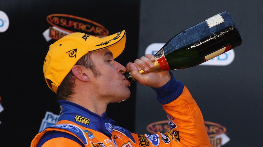Victory is sweet ... Will Davison enjoys the spoils of a Phillip Island win on Sunday.
