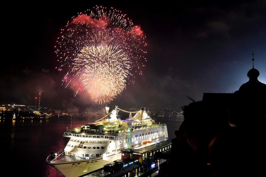Fireworks explode over Stadsgardskajen Quay during New Year's Eve celebrations in Stockholm.