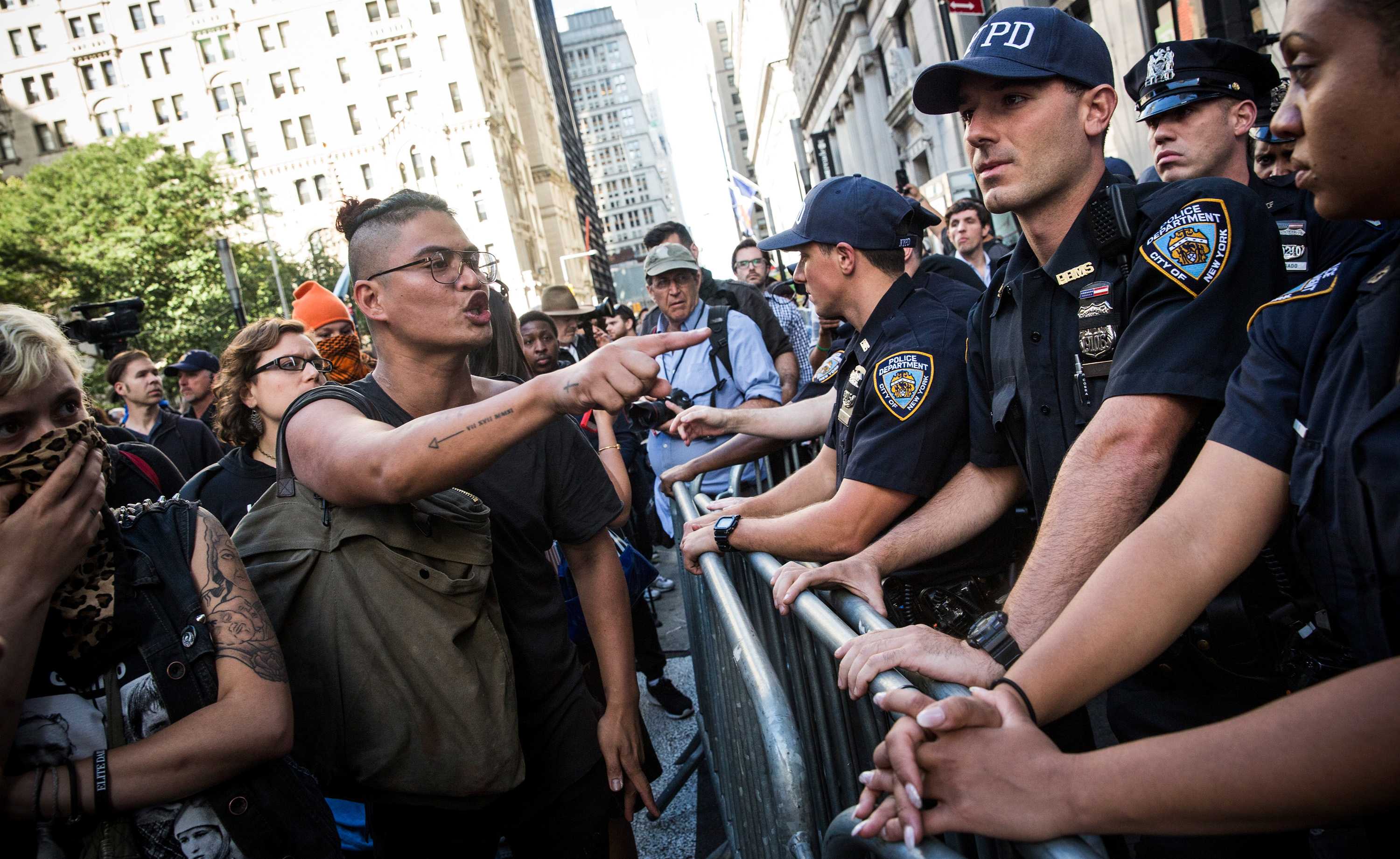 Dozens arrested as climate change protesters march on Wall Street - ABC ...