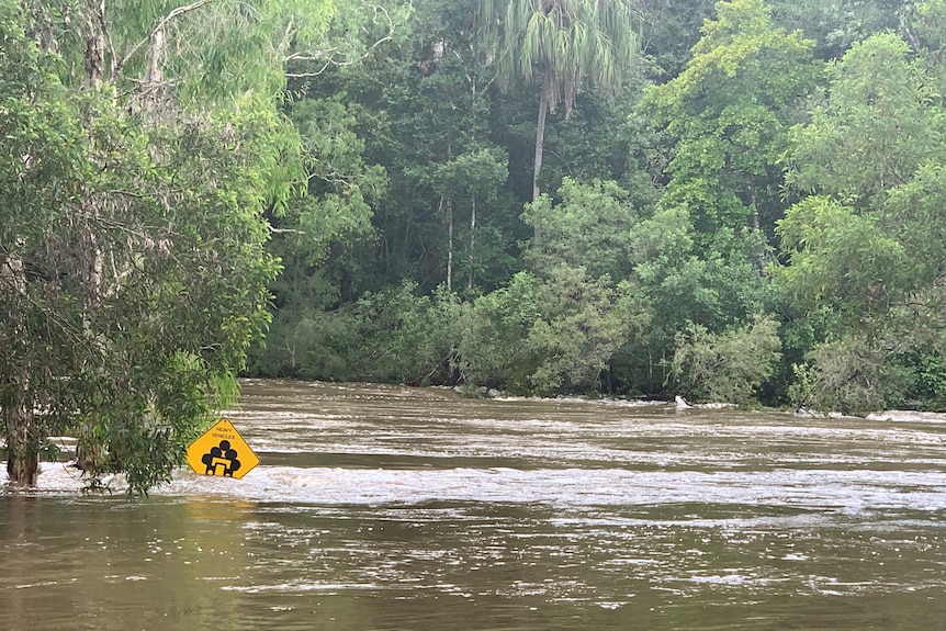 Major flood waters over a road.