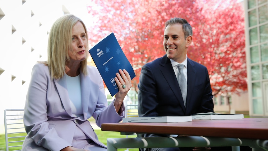 Katy Gallagher, sitting with Jim Chalmers, holds the women's economic budget statement 