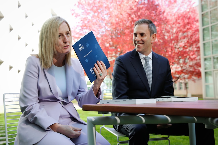 Katy Gallagher, sitting with Jim Chalmers, holds the women's economic budget statement 
