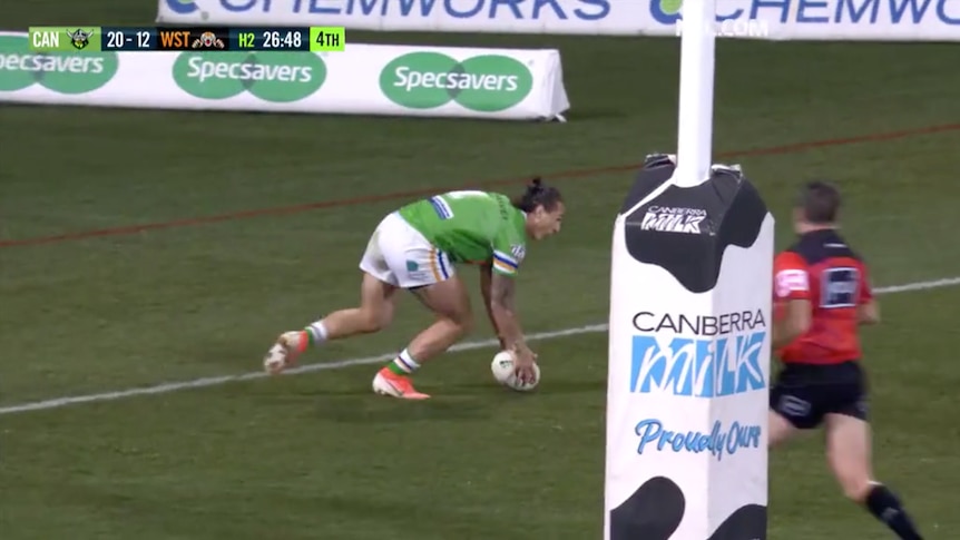 A screengrab of a broadcast of a rugby league player escaping the in-goal area