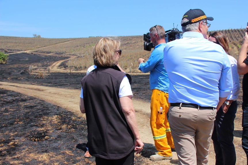 Scott Morrison visits the Adelaide Hills fire ground amid blackened hillsides.