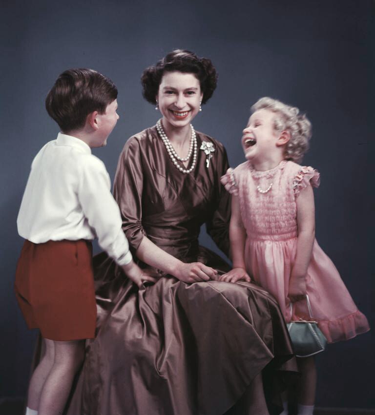 The Queen sits for a picture with her children Princess Anne and Prince Charles.