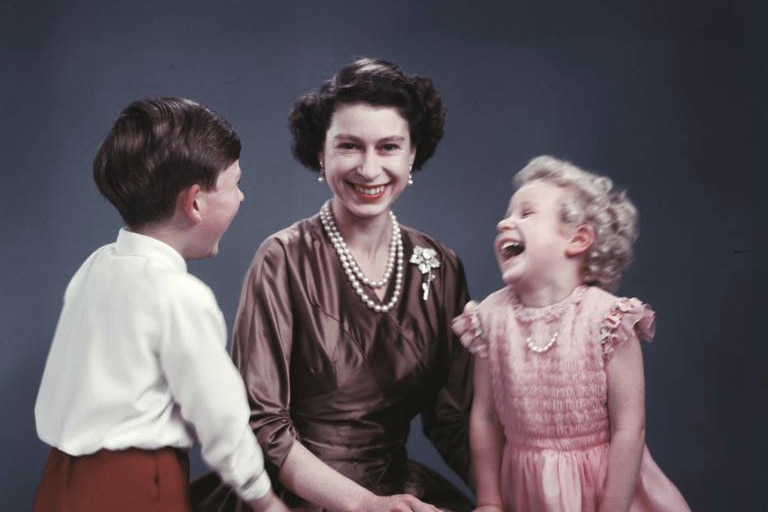 The Queen sits for a picture with her children Princess Anne and Prince Charles.