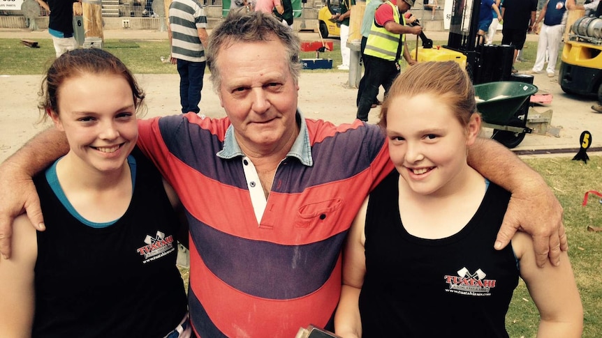Woodchopping sister Lucy and Kate Backhouse with father Howard
