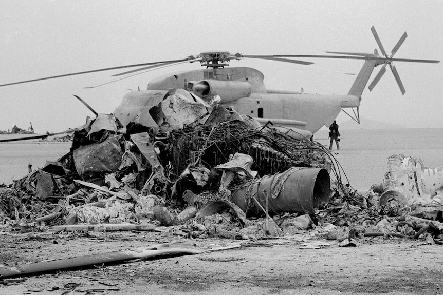 An old photo of the charred remains of a helicopter
