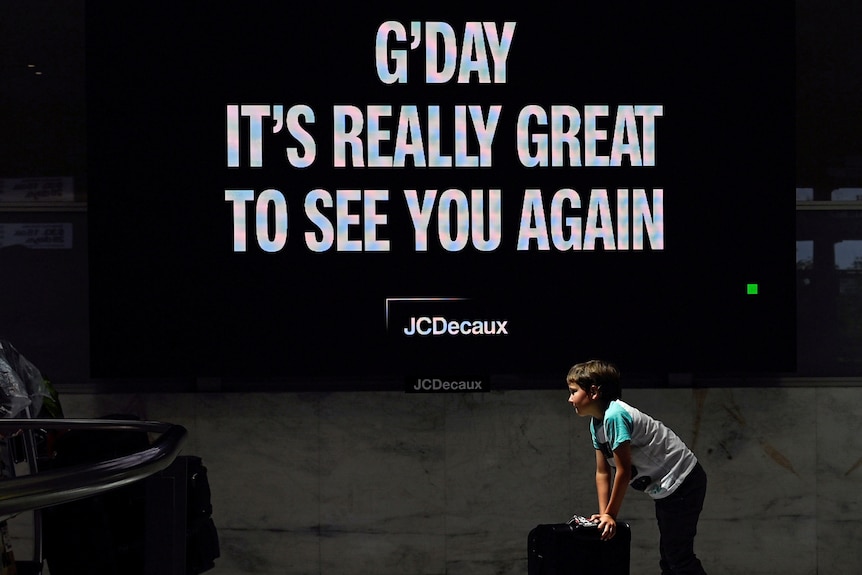 A sign at Sydney airport reads 'G'day it's really great to see you again'