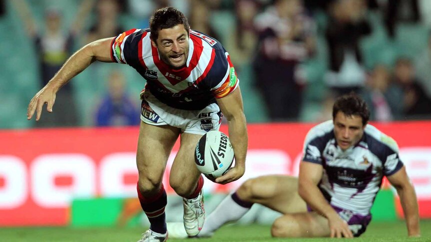 Floodgates open ... Anthony Minichiello scores between the posts for the Roosters.