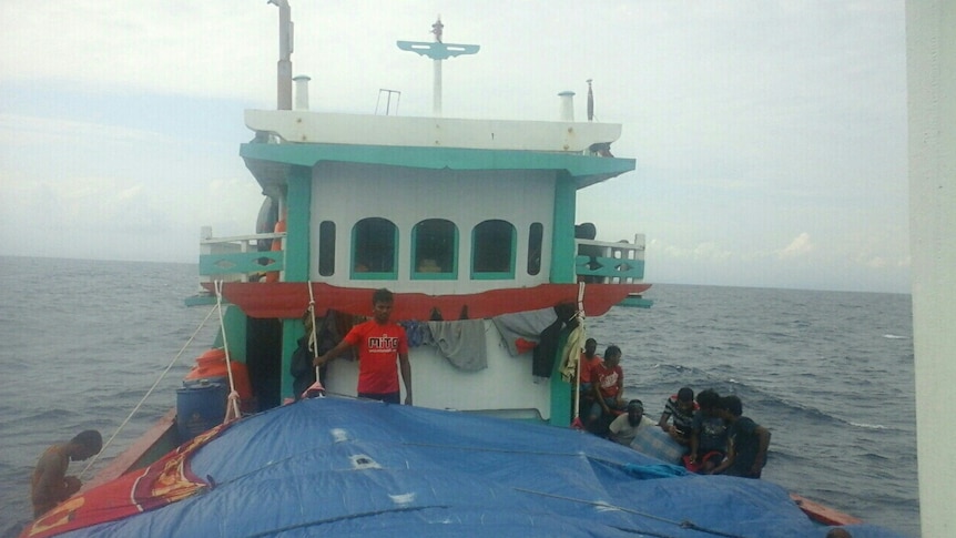 Passengers onboard an Indonesian people smugglers' boat