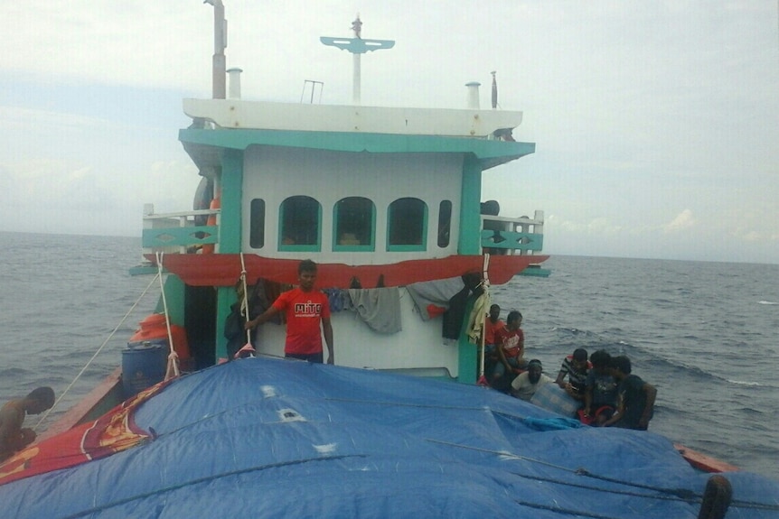 Passengers onboard an Indonesian people smugglers' boat