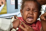 A baby cries while receiving a polio immunisation in Papua New Guinea.