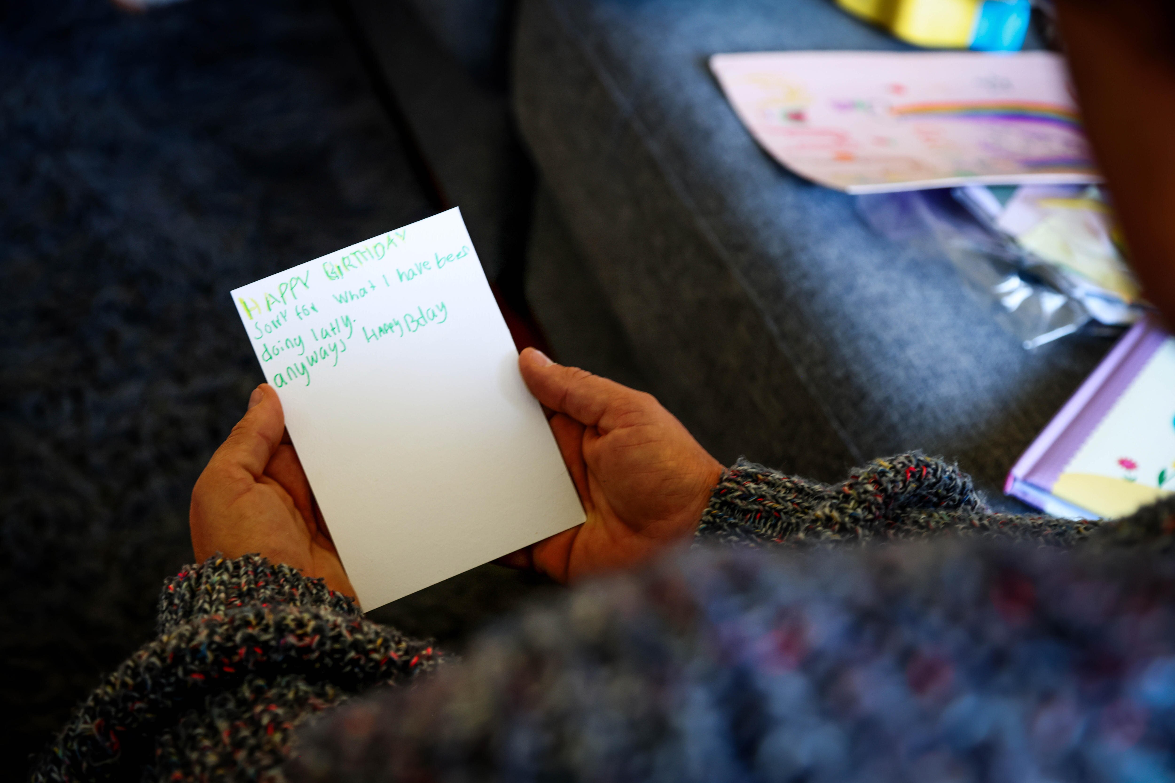 Ella holding a jumper that Jesse wore as a toddler.