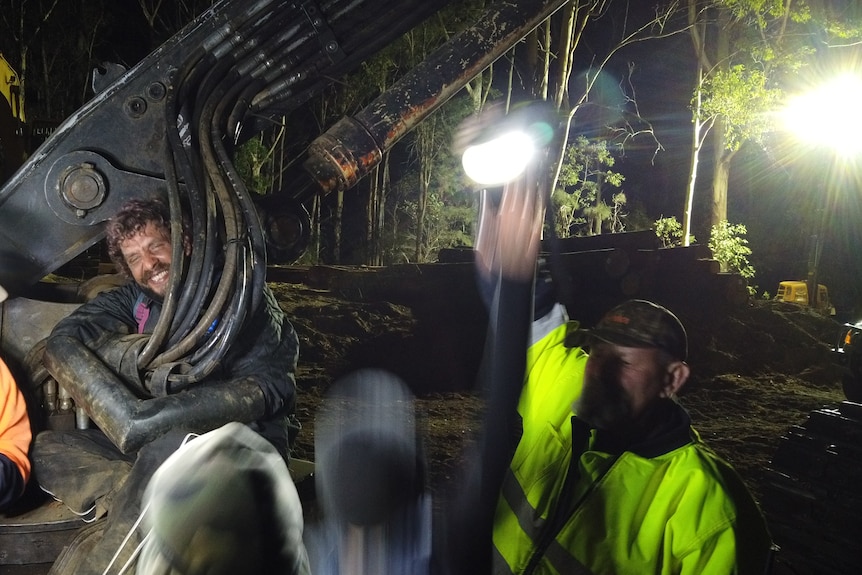 Indigenous man Wilkarr Kurikuta chains himself to Forestry equipment in Newry State Forest,