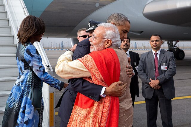 Mr Obama embraces Indian Prime Minister Narendra Modi on the tarmac in New Delhi