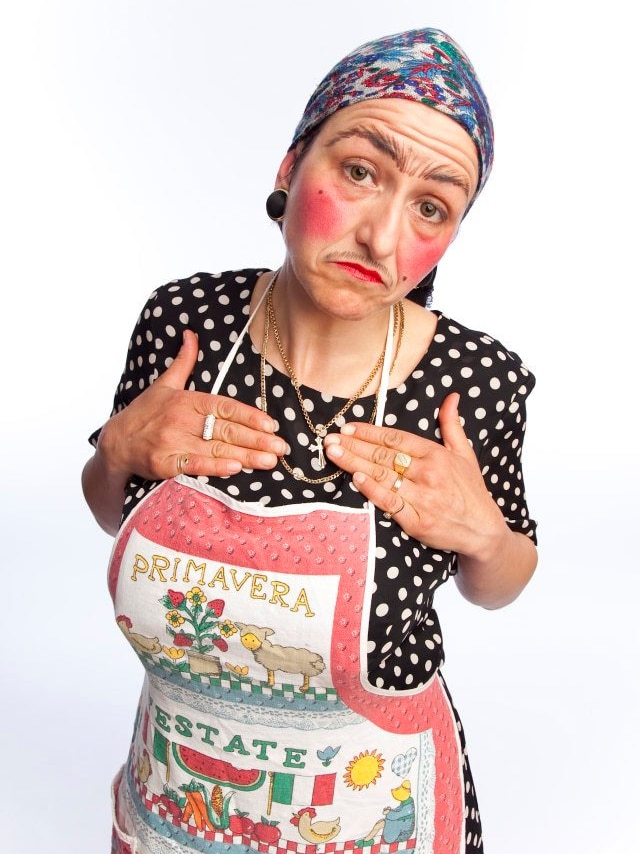Picture of a woman wearing an apron and a scarf