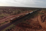 A freight train in the outback, as seen from above.