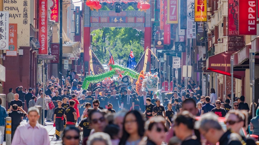 Crowds gather in Little Bourke Street to watch lion and dragon dance performances.