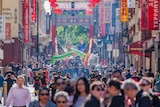 Crowds gather in Little Bourke Street to watch lion and dragon dance performances.