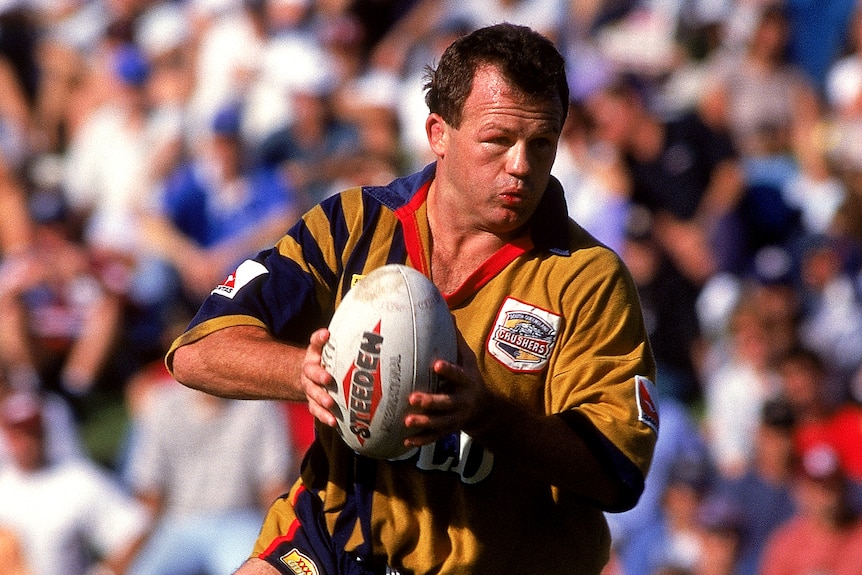 A man looks to pass the ball during a match