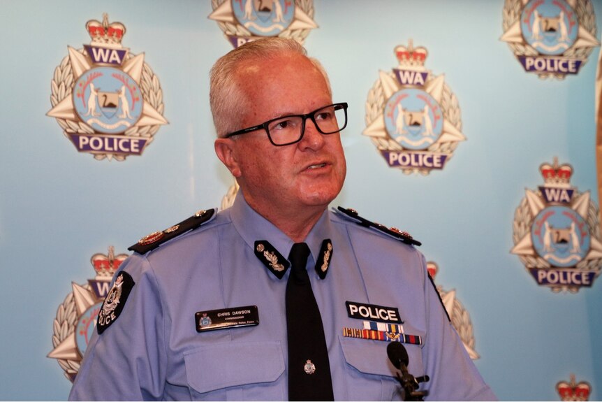 A close-up picture of WA Police Commissioner Chris Dawson in front of police signage.