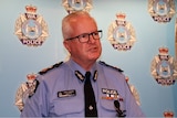 A close-up picture of WA Police Commissioner Chris Dawson in front of police signage.