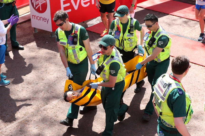 A runner receives medical attention after the London Marathon. April 22, 2018.