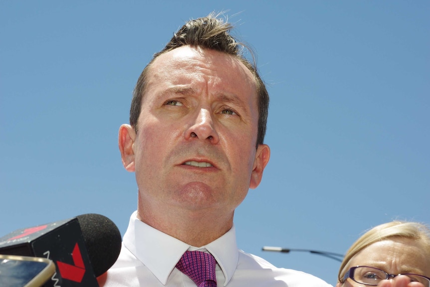 A  head shot of Mark McGowan talking to reporters.